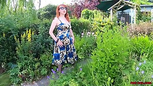Busty babe Red XXX fingers herself in the garden